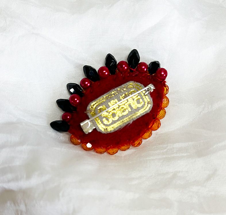 Tangerine Eye brooch