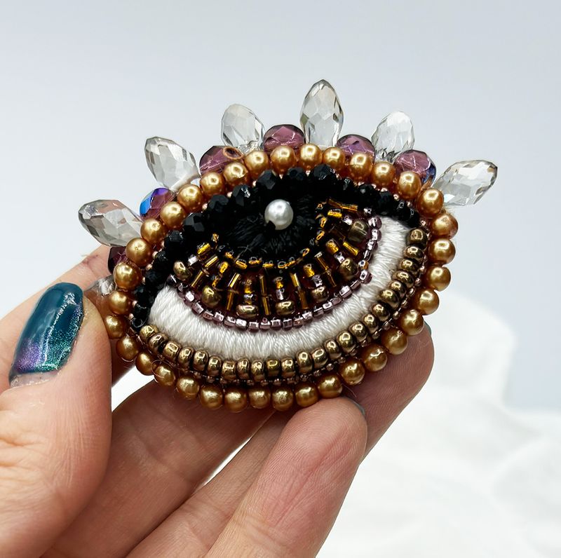 Pale gold Eye brooch