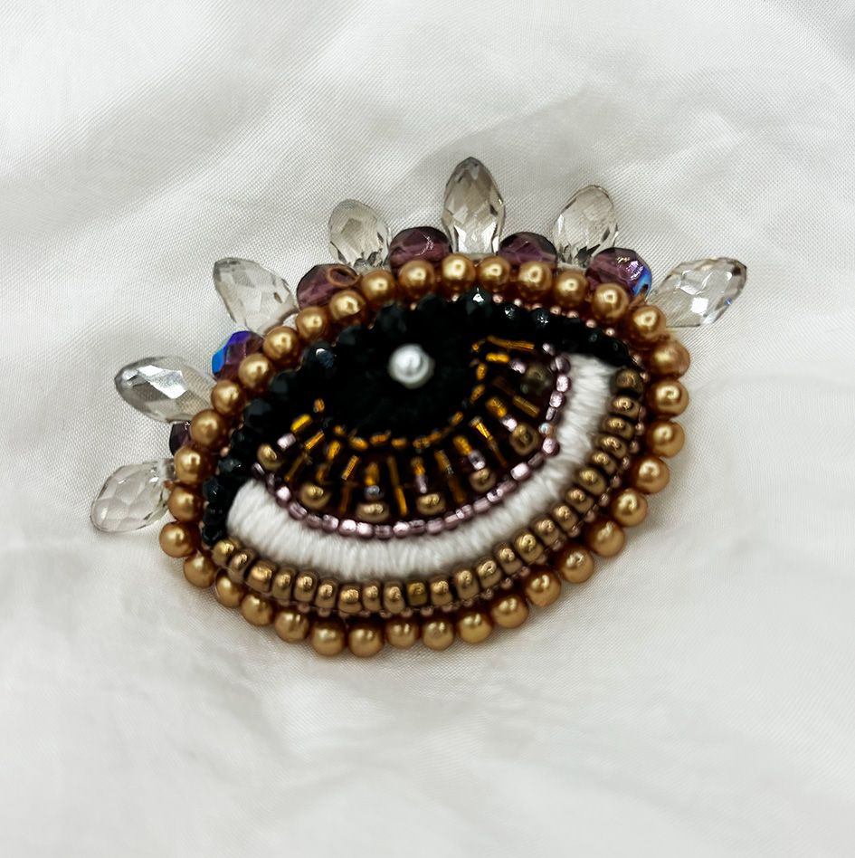 Pale gold Eye brooch