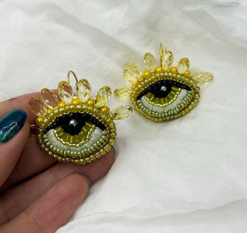 Greenish yellow Eye earrings