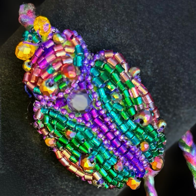 Emerald green, purple and gold