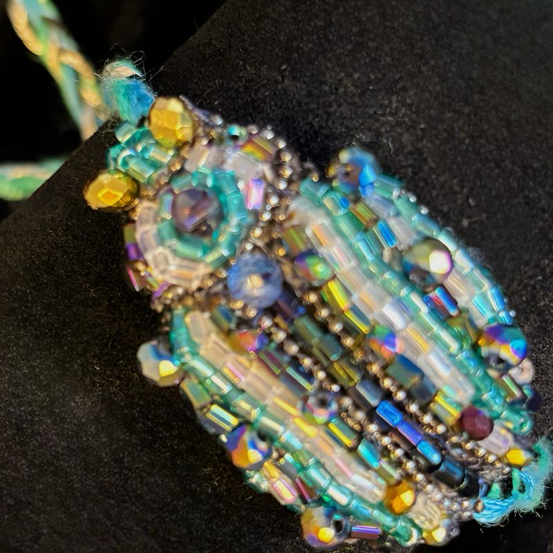 Turquoise, mauve and pearly white