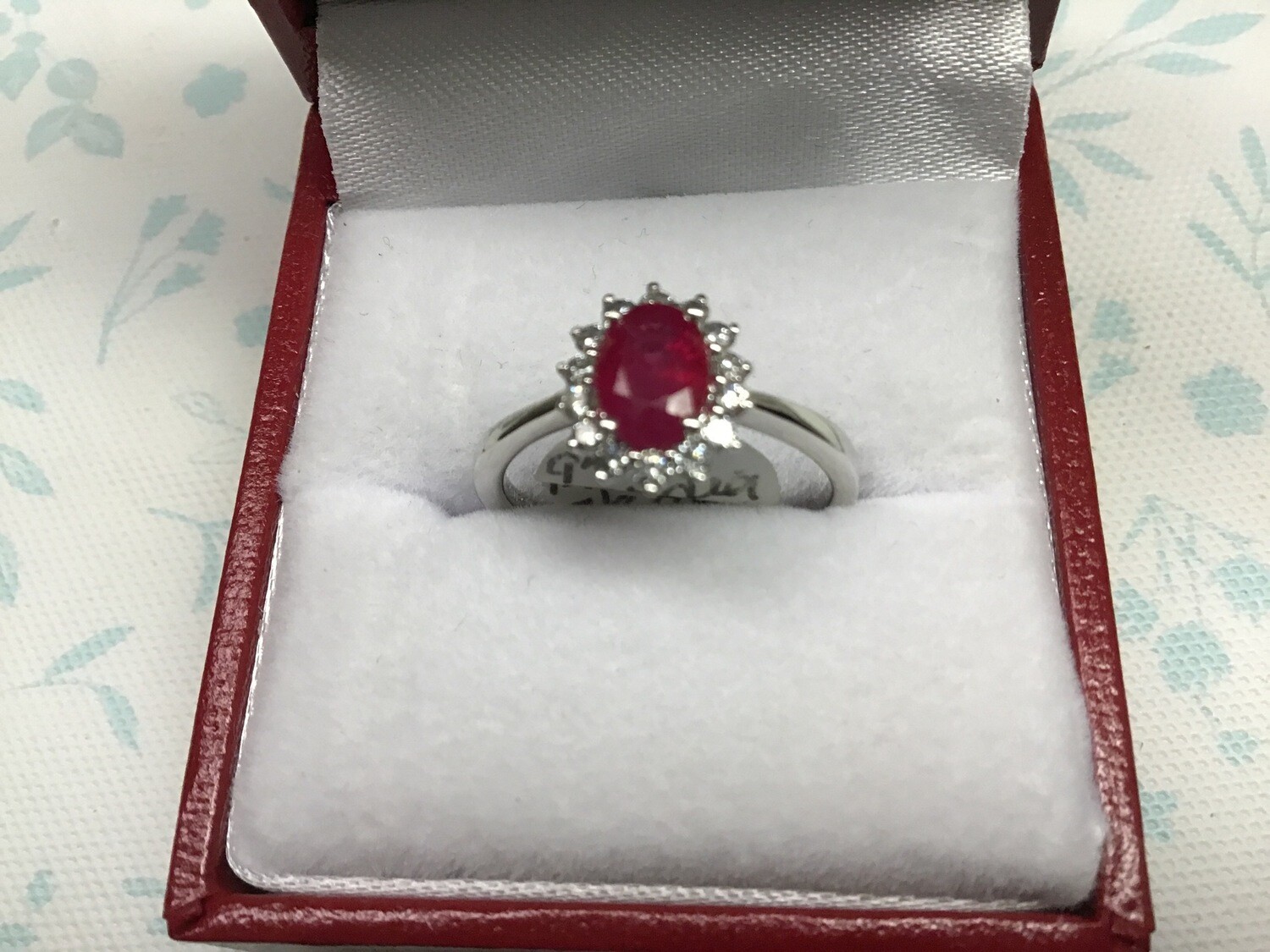 Ruby Ring ( Genuine) Oval Surrounded by Round Diamonds set in 14 KT. White Gold