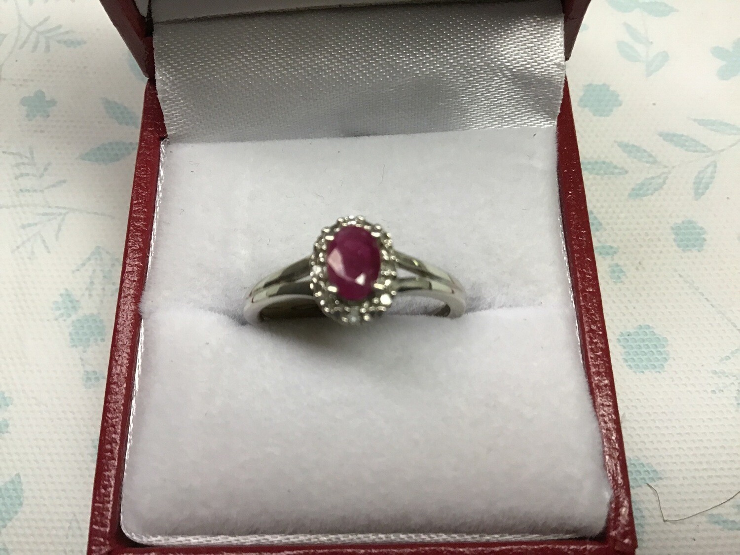 Ruby Ring (Genuine Ruby Oval Cut)with a Diamond Halo In a 10 Kt. White Gold setting