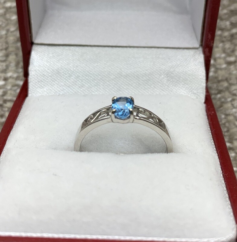 Blue Topaz Ring (Genuine Oval ) Swirl Accent Mounting set in 14Kt. White Gold