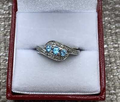 Blue Topaz Ring (3 Genuine Brilliant Cut) with Diamond Accents set in 10 Kt. White Gold
