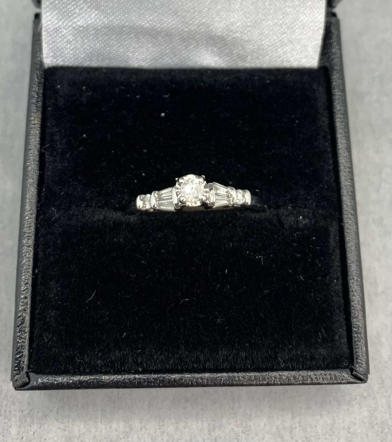 Brilliant Round Center With Baguettes Engagement Ring 30 Pt Total Weight set in White Gold