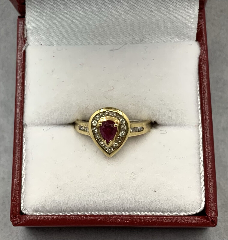 Ruby Ring Pear Shape With Diamond Accents set in 14 Kt Yellow Gold