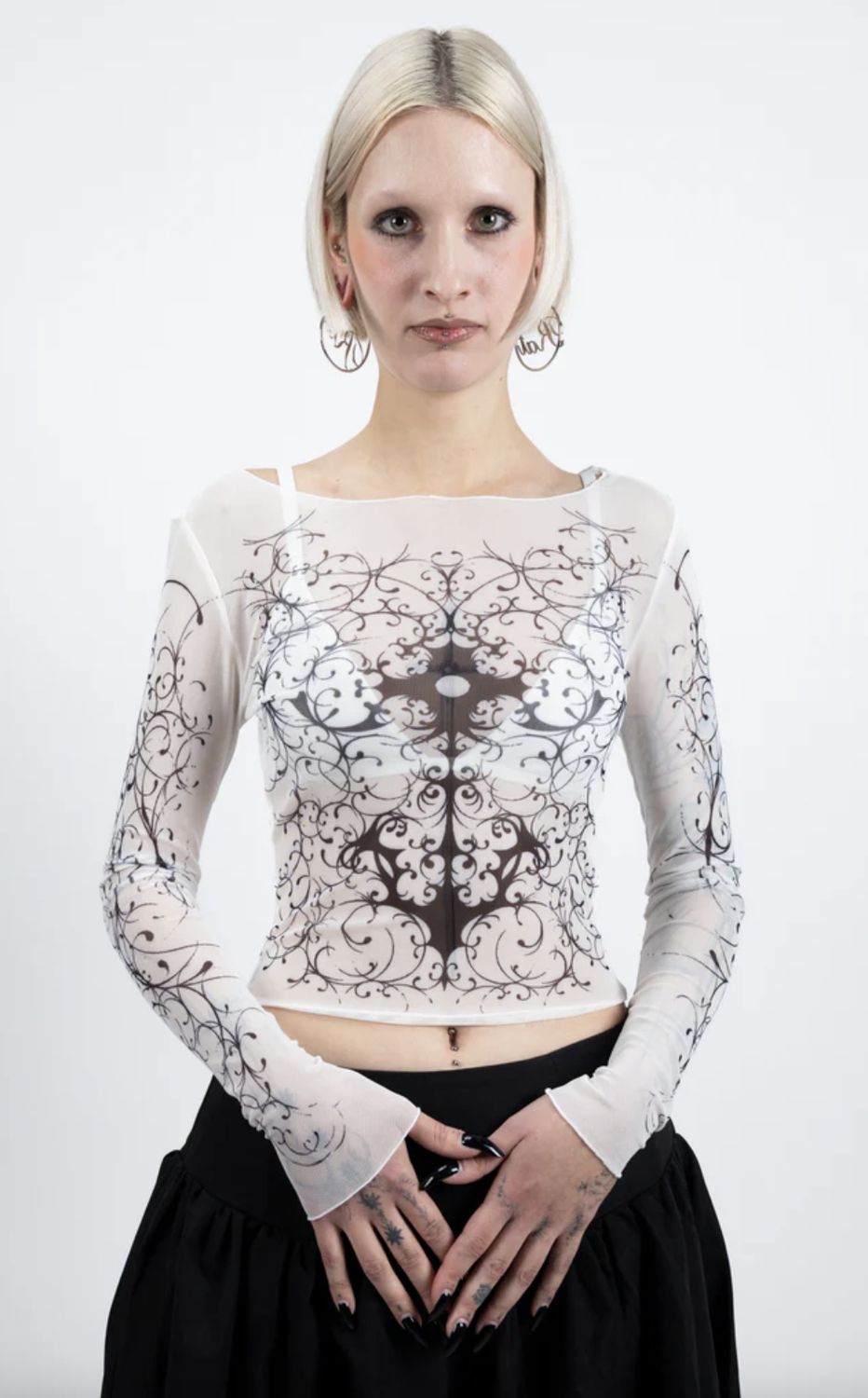 White knit sweater with black patterns