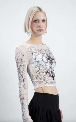 White knit sweater with black patterns
