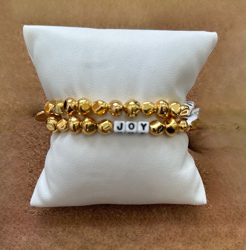 Little Words Joy Bracelet with gold beaded design and “Joy” word
