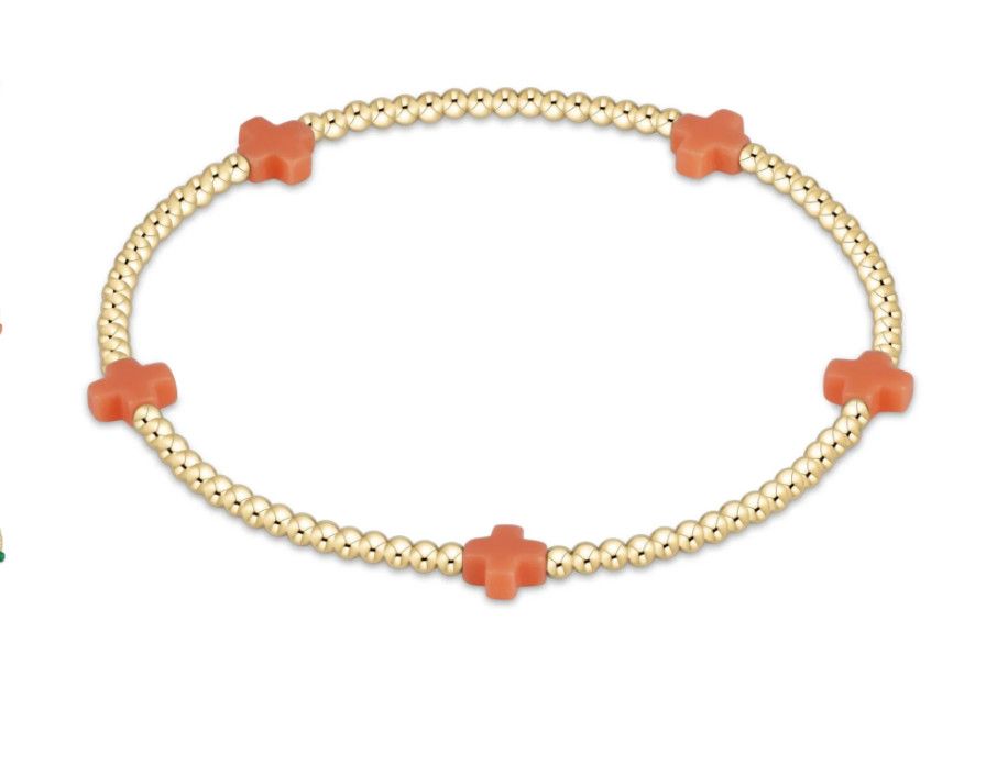 Dainty 2mm gold beaded bracelet with small signature cross charm by enewton, perfect for everyday wear or stacking