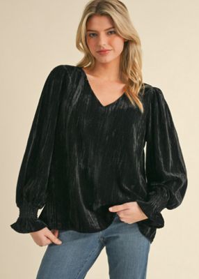 Glossy velvet top with V-neck and long poet sleeves.