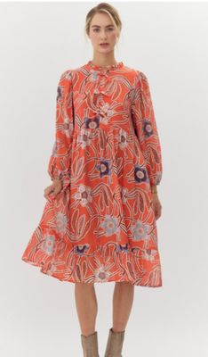 Floral print midi dress with frilled neck featuring ribbon-tie, side pockets, long bubble sleeves, and wide ruffly hemline