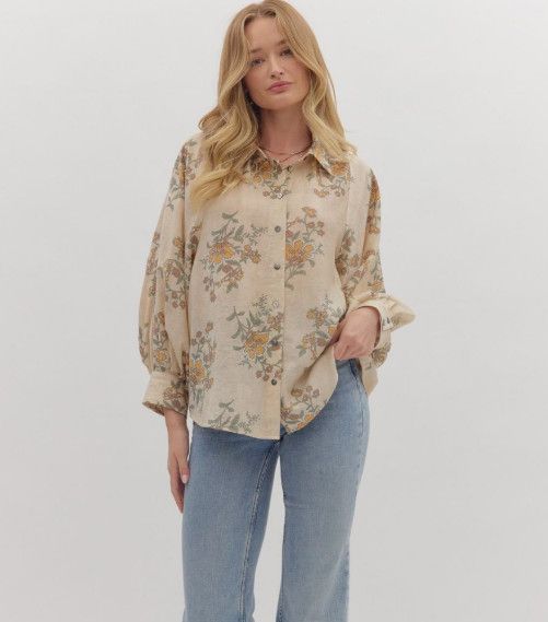 Floral print long sleeve top featuring button front closure and soft pleating at the shoulders and back yoke