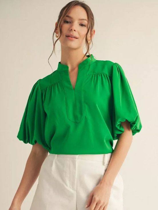 Short puff sleeves mock neck top, shirring detail, v neckline.