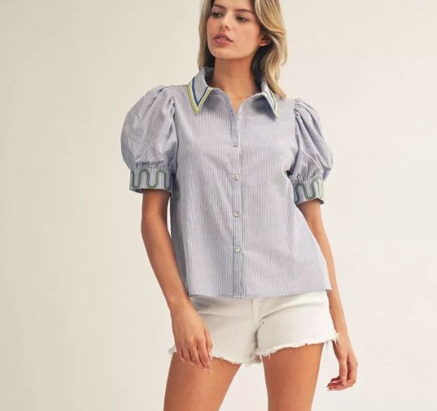 Short puff sleeves button down pinstripe top with embroidery detail. Short puff sleeves button down pinstripe top with embroidery detail.