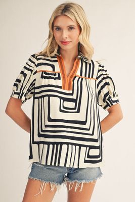Short sleeves Geo print top with solid contrast accent.