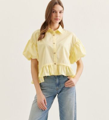 Solid short puff sleeve top featuring ruffle hem detail