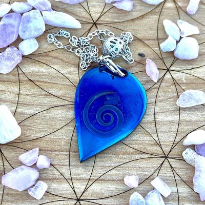 Luna Ignis Pendulum Hand forged colorized iron with Neolithic Spiral