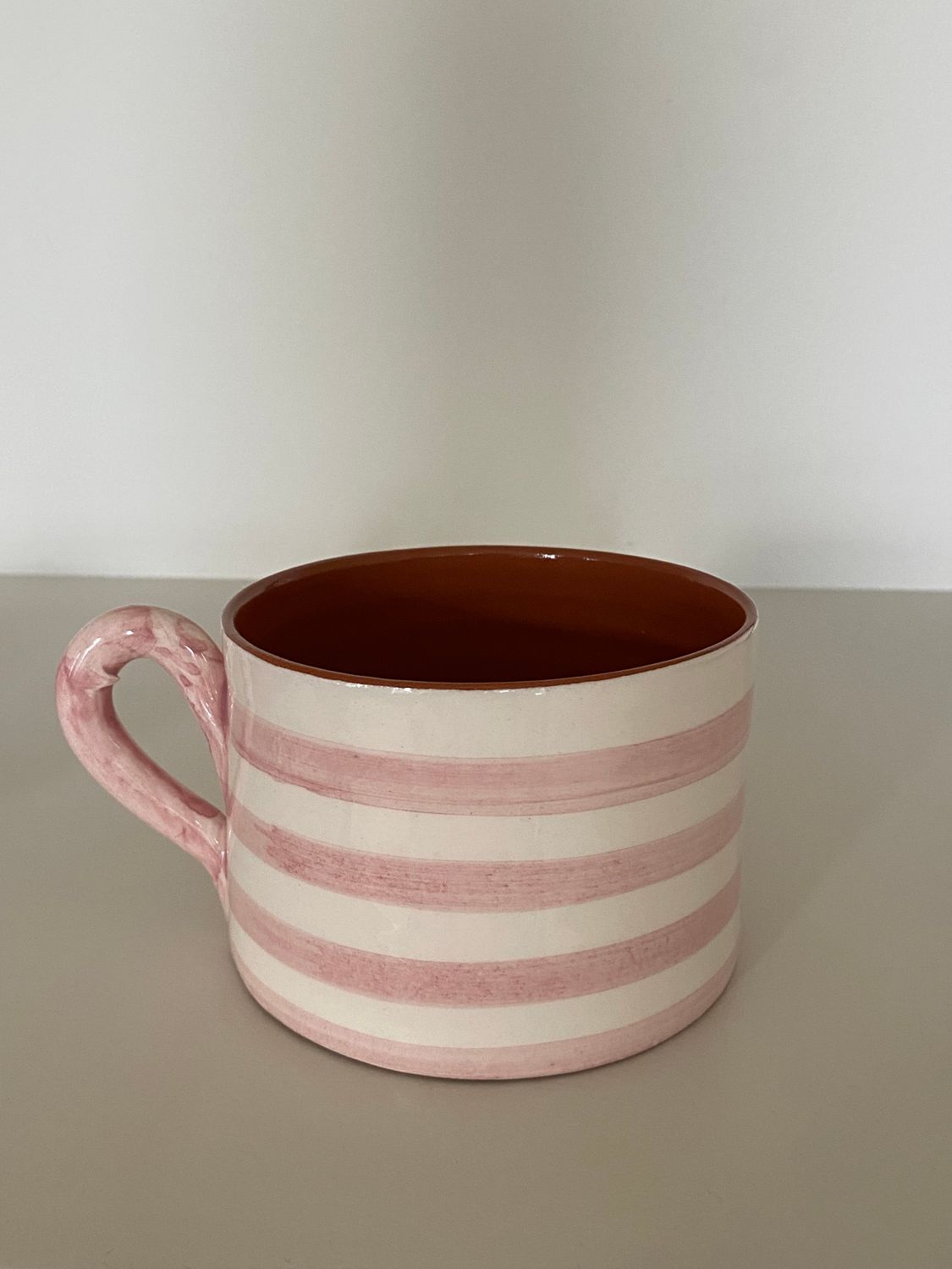 Grote kop, horizontale streep, roze en terracotta