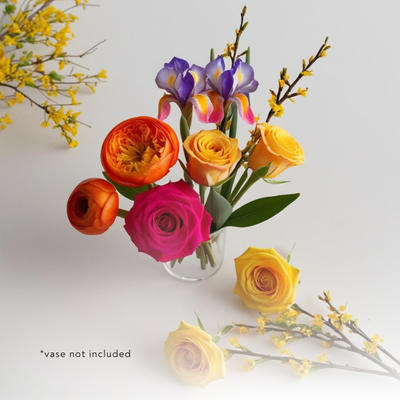 Inspired by Harvard&#39;s wellness insights, this 6-10 stem bouquet delivers a burst of natural energy with orange Ranunculus, hot pink roses, and yellow spray roses