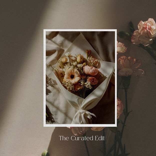 Soft Haze bouquet by Coco Fleur – hand-tied blush and peach blooms in white wrap.