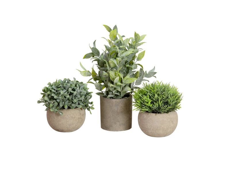 3 pientä tekokasvia ruukuissa