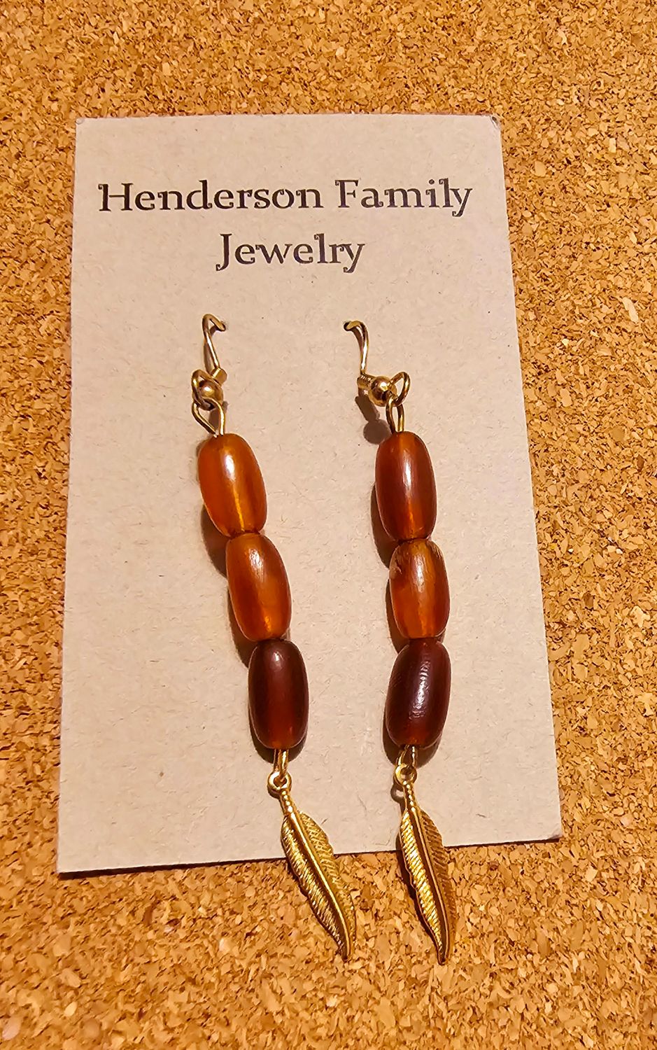 Gold feathers 🪶 with brown beads