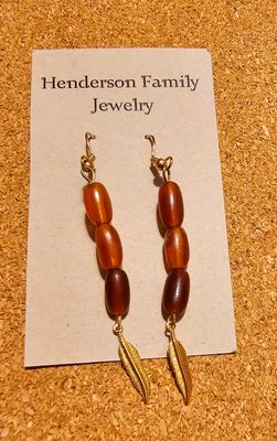 Gold feathers 🪶 with brown beads