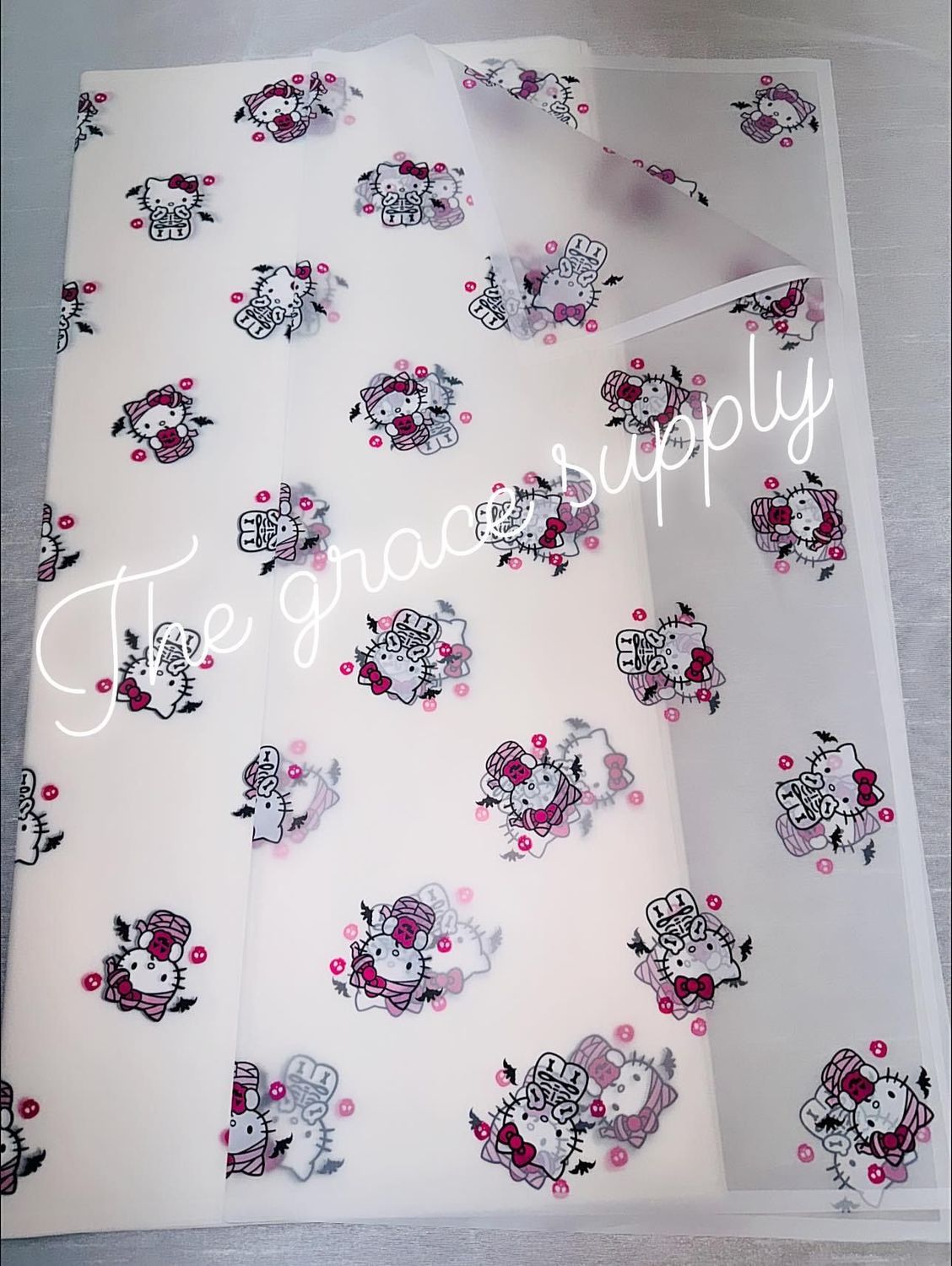 White translucent skull hello kitty paper