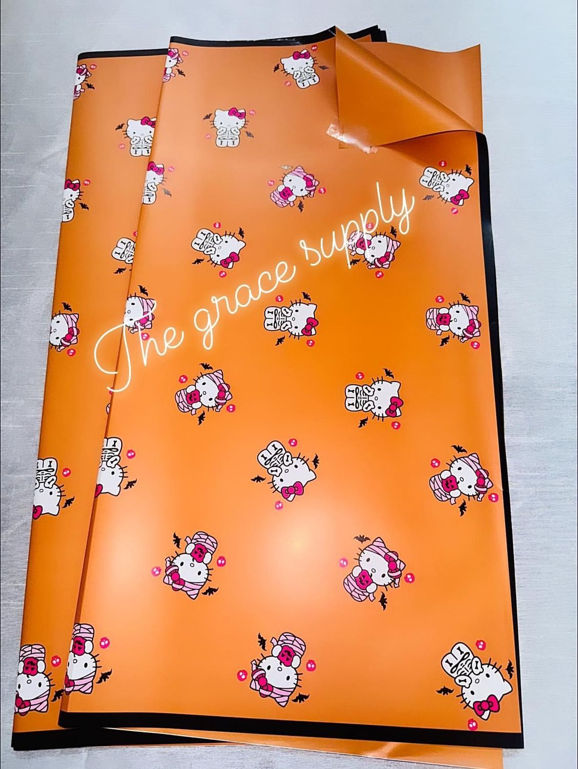 Orange solid skull hello kitty paper