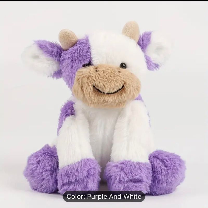 Purple and white cuddly cow plush