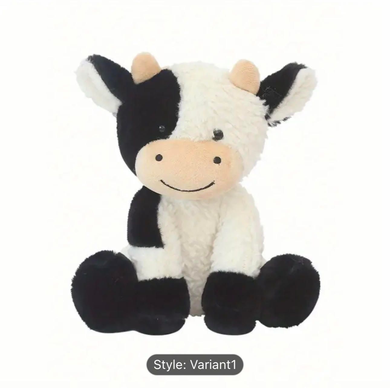 Black and white cuddly cow plush