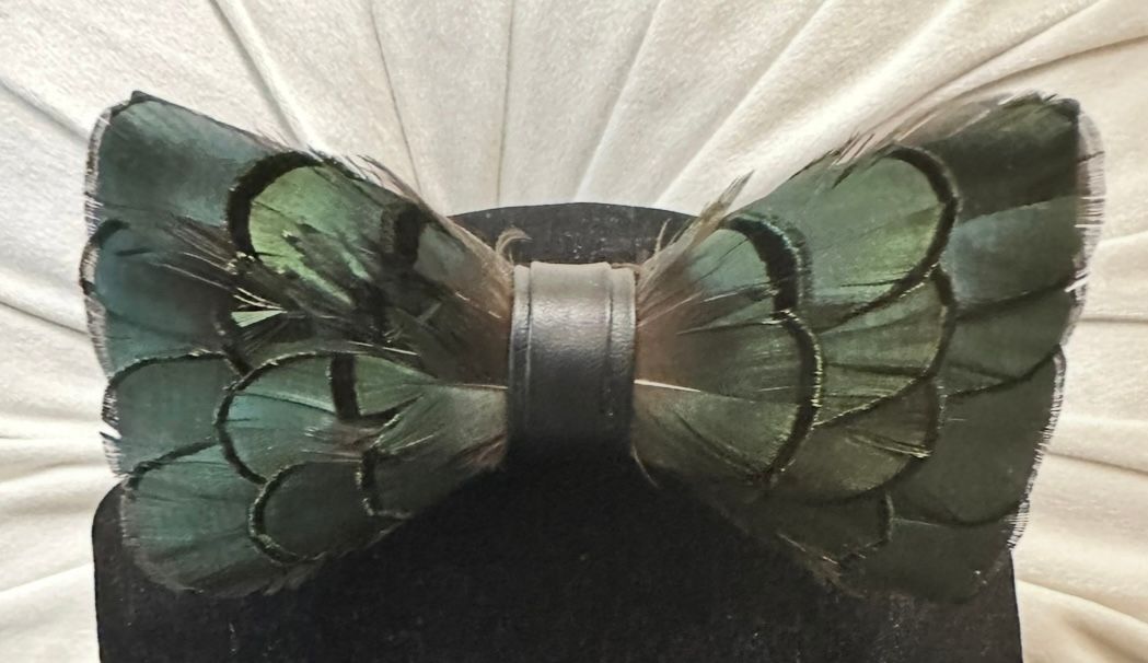 Green Feather with a lapel pin
