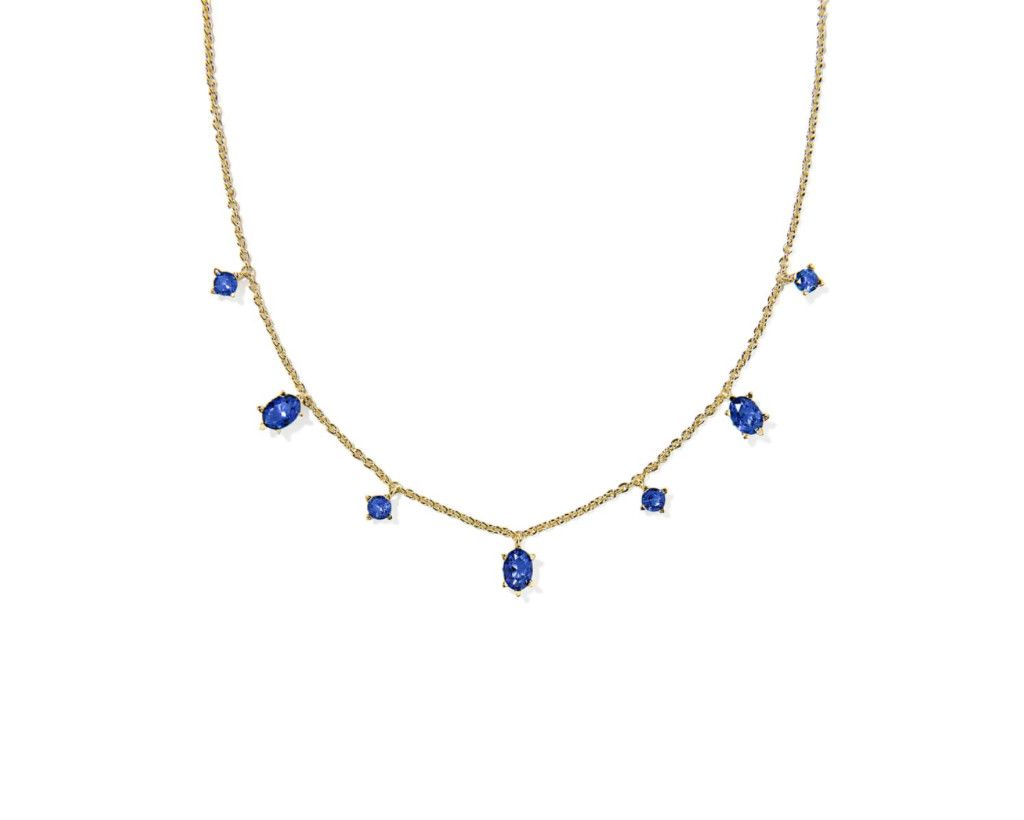 Cailin delicate strand necklace in gold with blue crystal accents, elegant layered jewelry for everyday wear