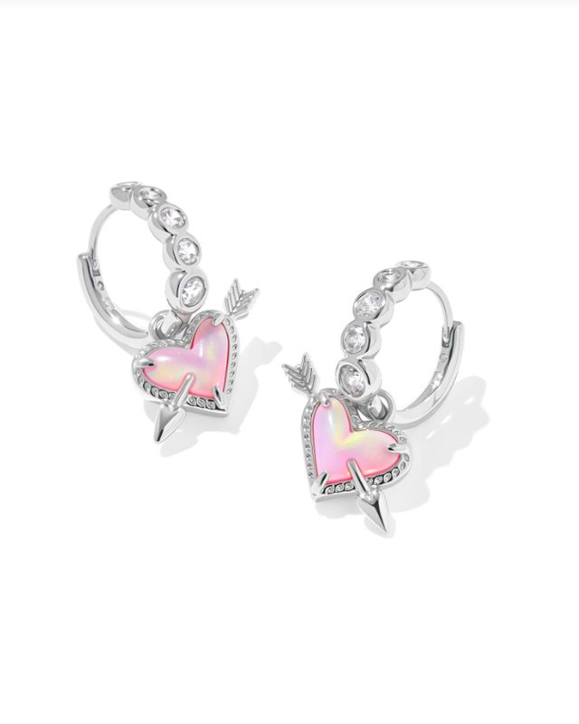 The Ari Heart Arrow Huggie Earring in Pink Opalescent Resin
