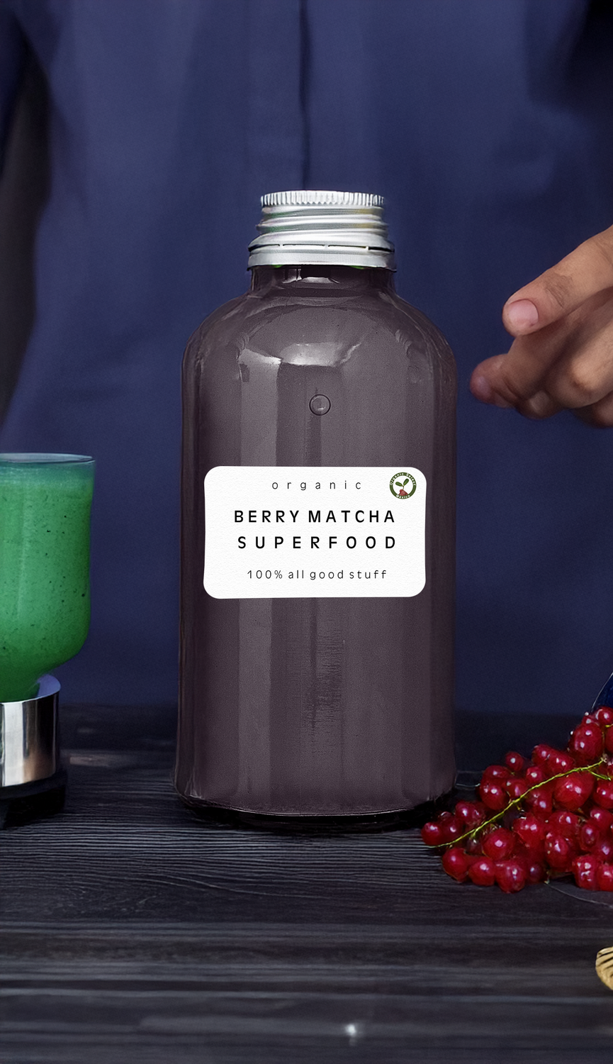 Bottle of Berry Matcha smoothie with fresh berries and matcha powder