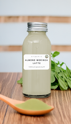 Bottle of Almond Moringa Latte smoothie with almond milk and moringa leaves