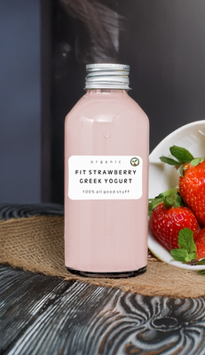  Bottle of Fit Strawberry Greek Yogurt Smoothie with fresh strawberries and a spoonful of yogurt
