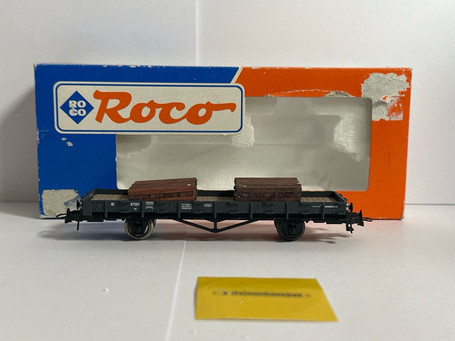Roco 46487 - Lageboordwagon met lading NS