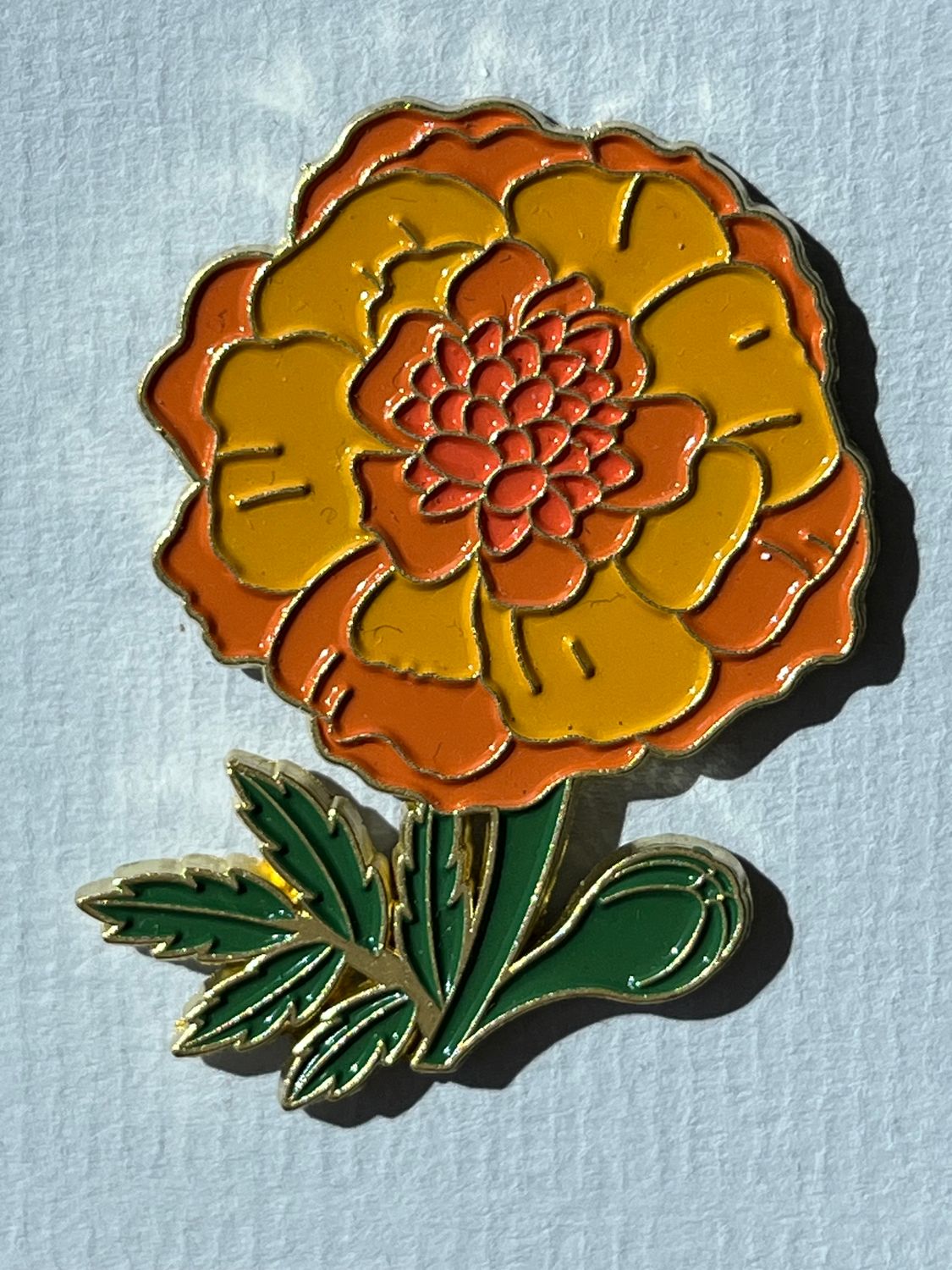 Pin bloem geel/oranje