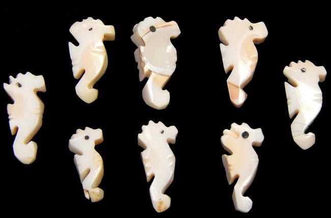 One seahorse carved from Luhanus shells, measuring 1/2 to .75 inches*****