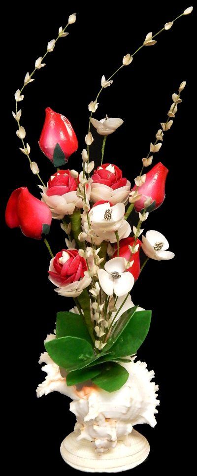One Canarium Roses Shell Flower Arrangement set in a murex shell, measuring 8 inches*******