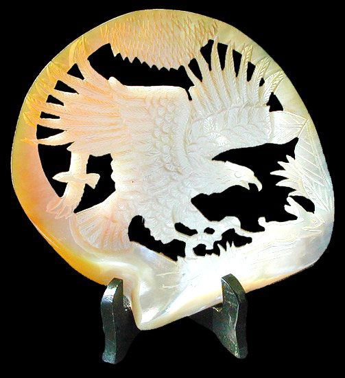 One Gold Lip Eagle art piece, Hand Carved from Gold Mother of pearl oyster, measuring 6 to 8 inches. Display stand not included. *****
