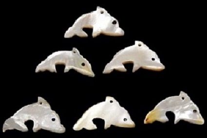 Troca Shells Hand Carved into Dolphins with a Drilled Hole measuring 1" Sold  Each