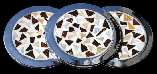 Silver Coaster with inlay bamboo, coral and Nautilus shell pieces measuring 3 1/2"  Sold Each   42326