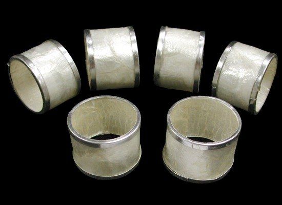 Silver Trim Capiz Napkin Rings measuring 2"  Sold Each