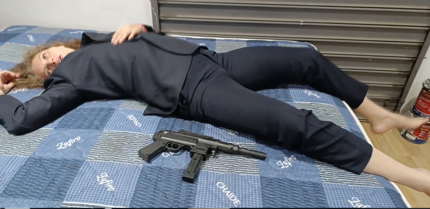 Punishing sexy henchwoman in suit
