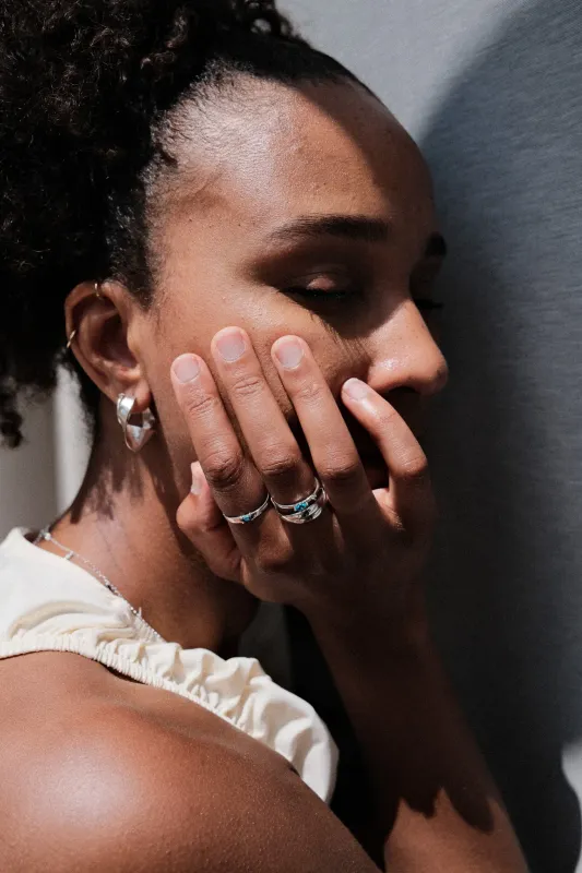 Silver Folded Hoops by Xzota, worn on the hand, handcrafted in Bali from 925 silver.